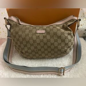 GUCCI GG  Tan Canvas Half Moon Crossbody w Pale Pink and Blue Adjustable Strap.